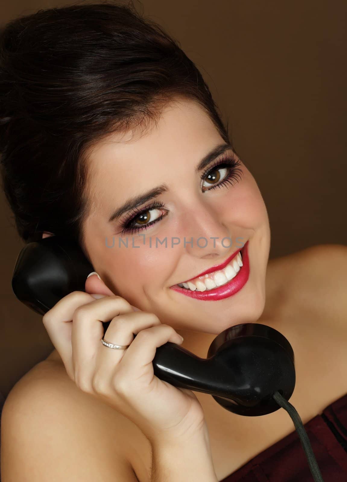 beautiful young woman with vintage telephone