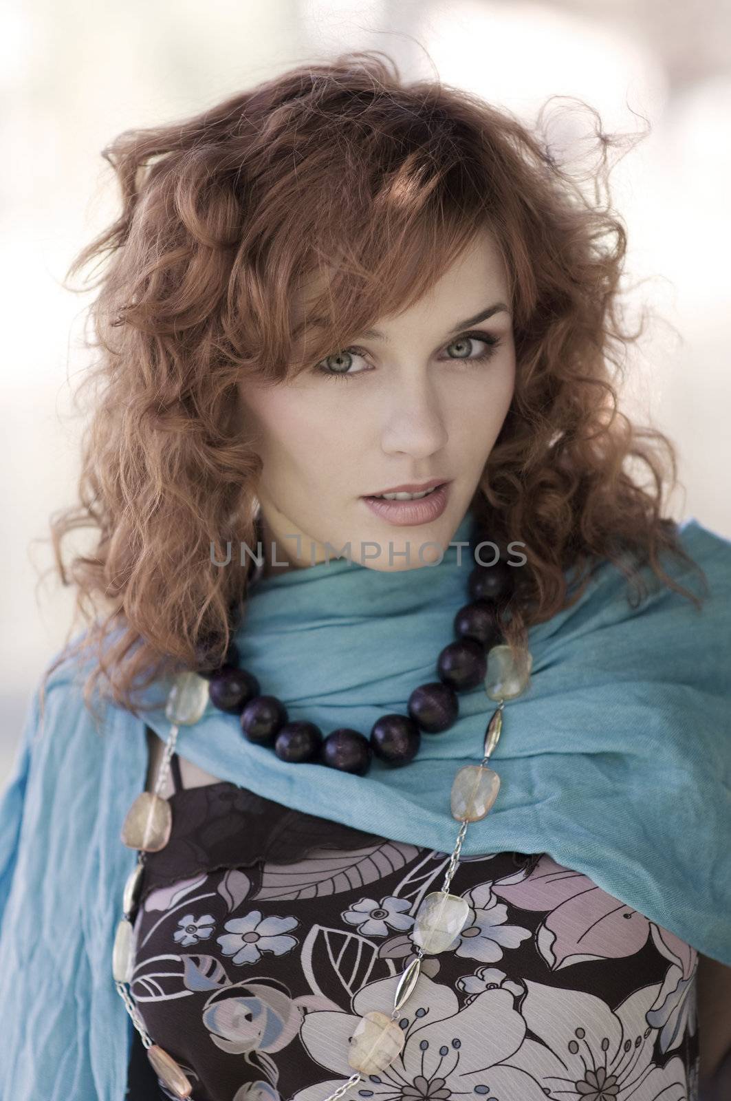 fashion close up in the park of a red haired girl in autumn dress