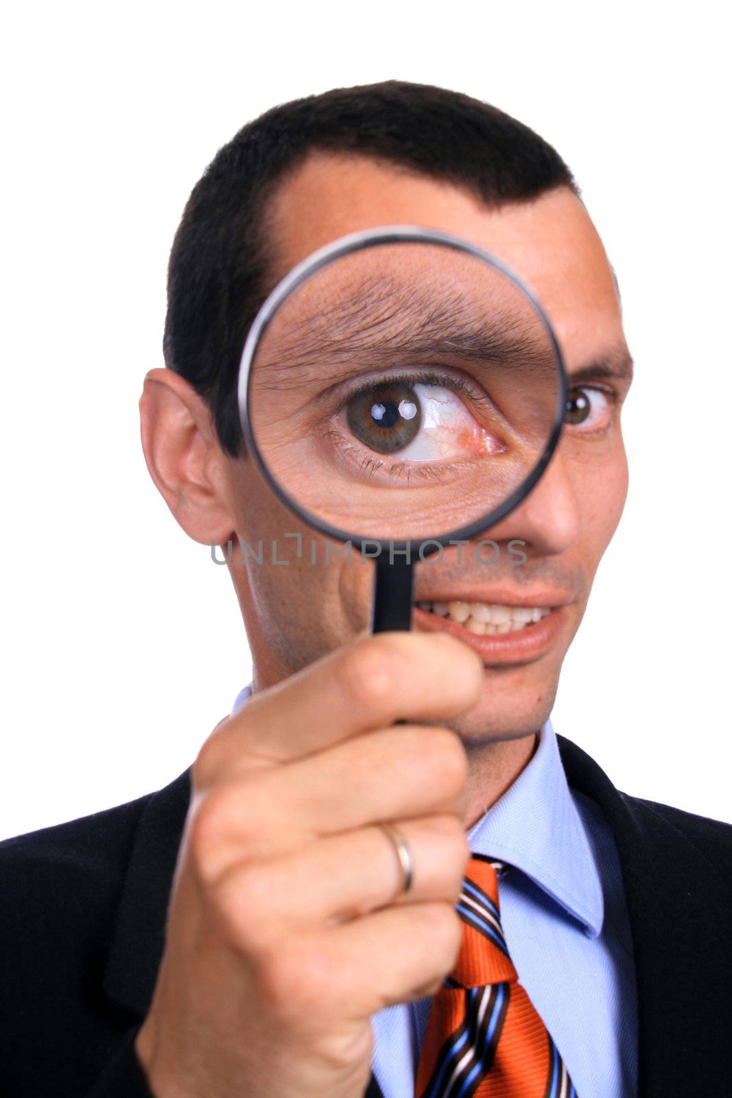 business man with a loupe over white background