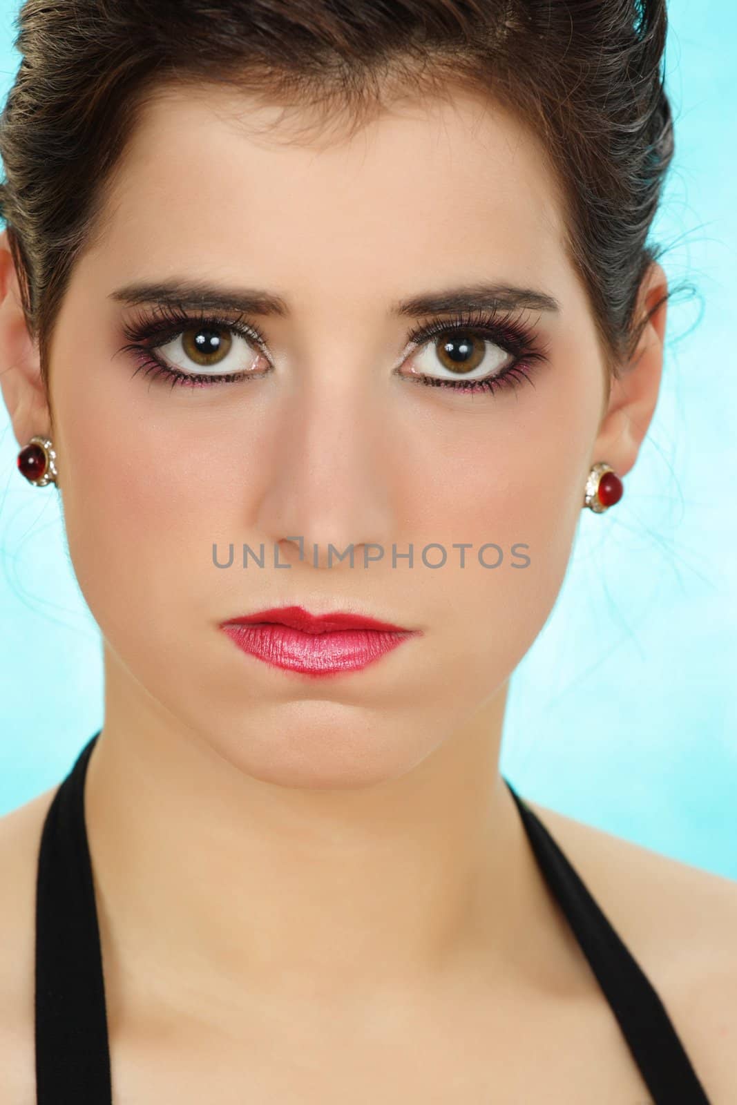 Closeup portrait of a beautiful unhappy young woman