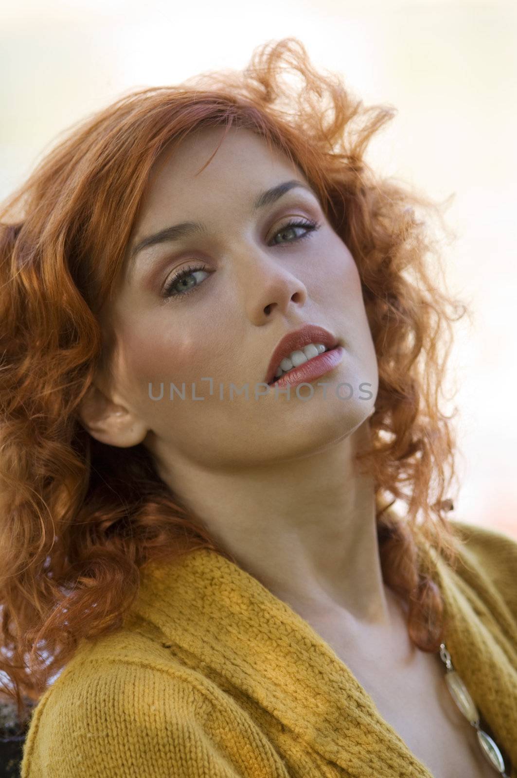 outdoor close up of red-haired woman and light eyes