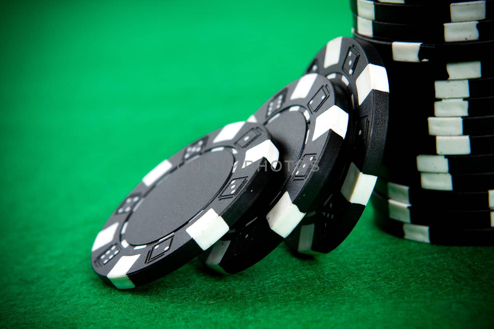 Stack of black poker chips by rachwal