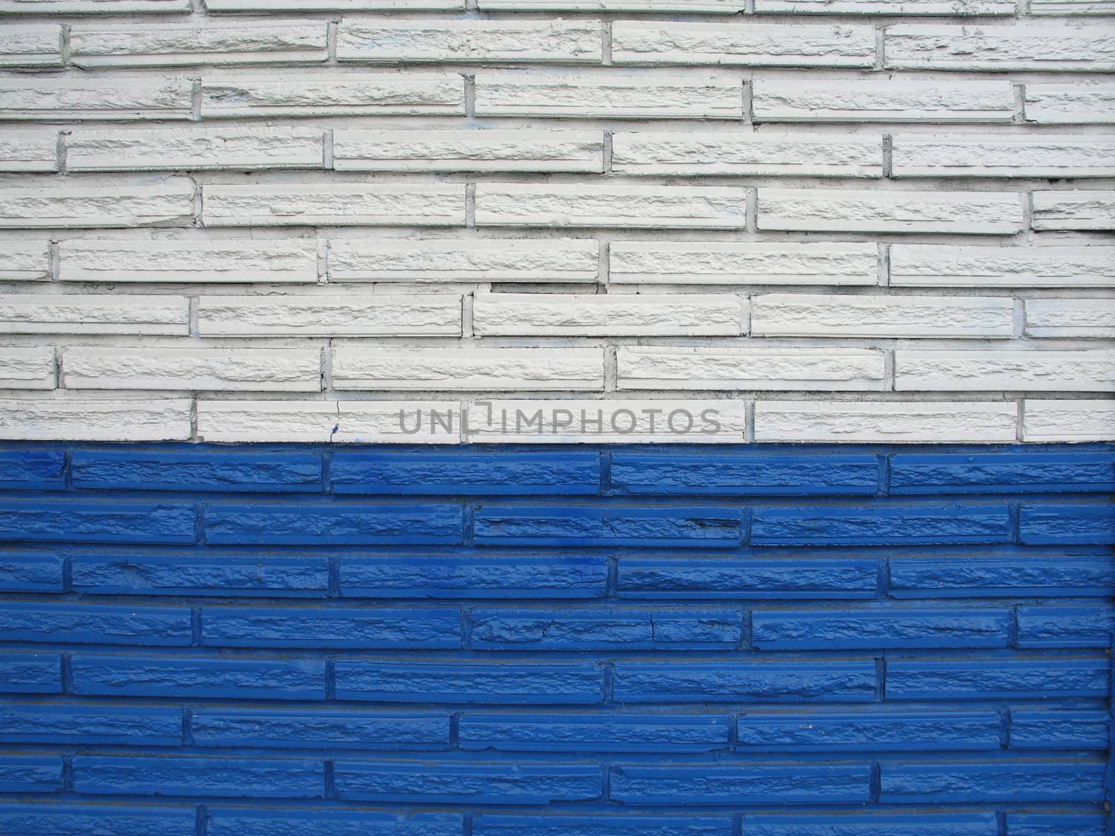 white and blue brick building by mmm