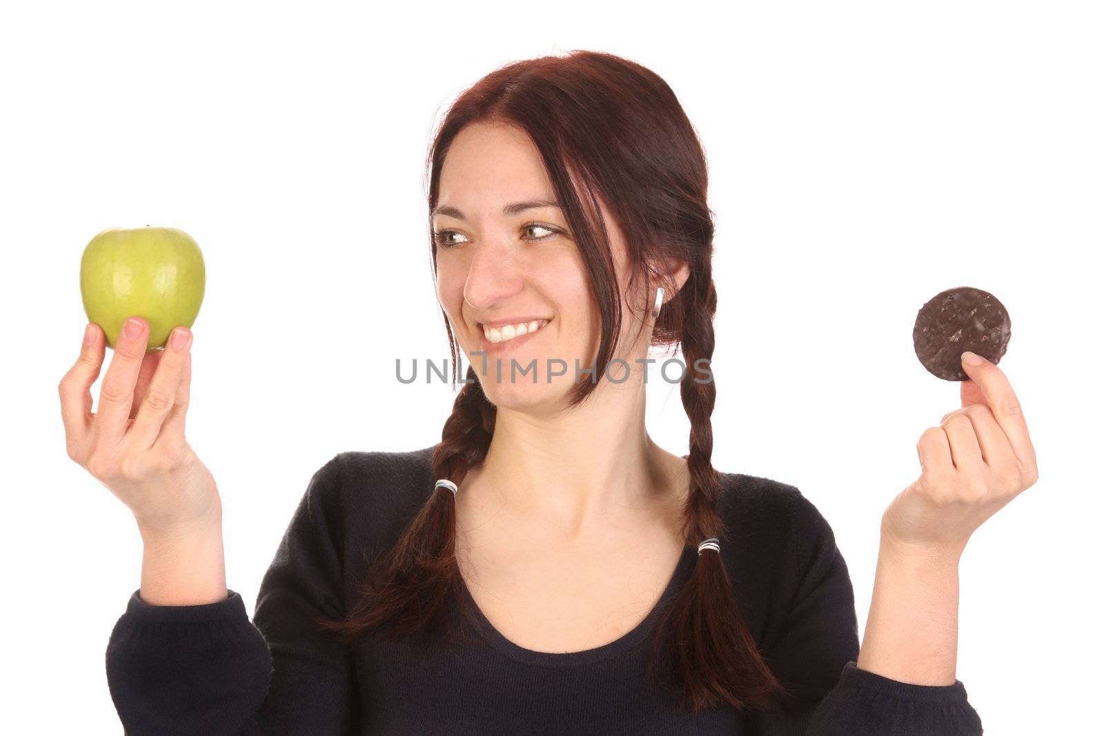 beautiful woman choosing between apple and chocolate cookies on white background 