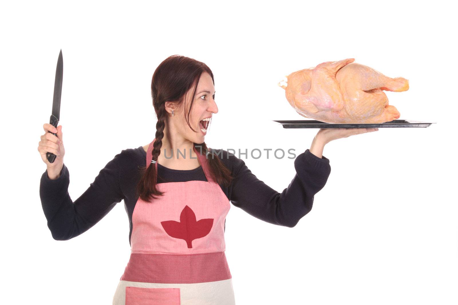 mad housewife with knife and chicken on white background