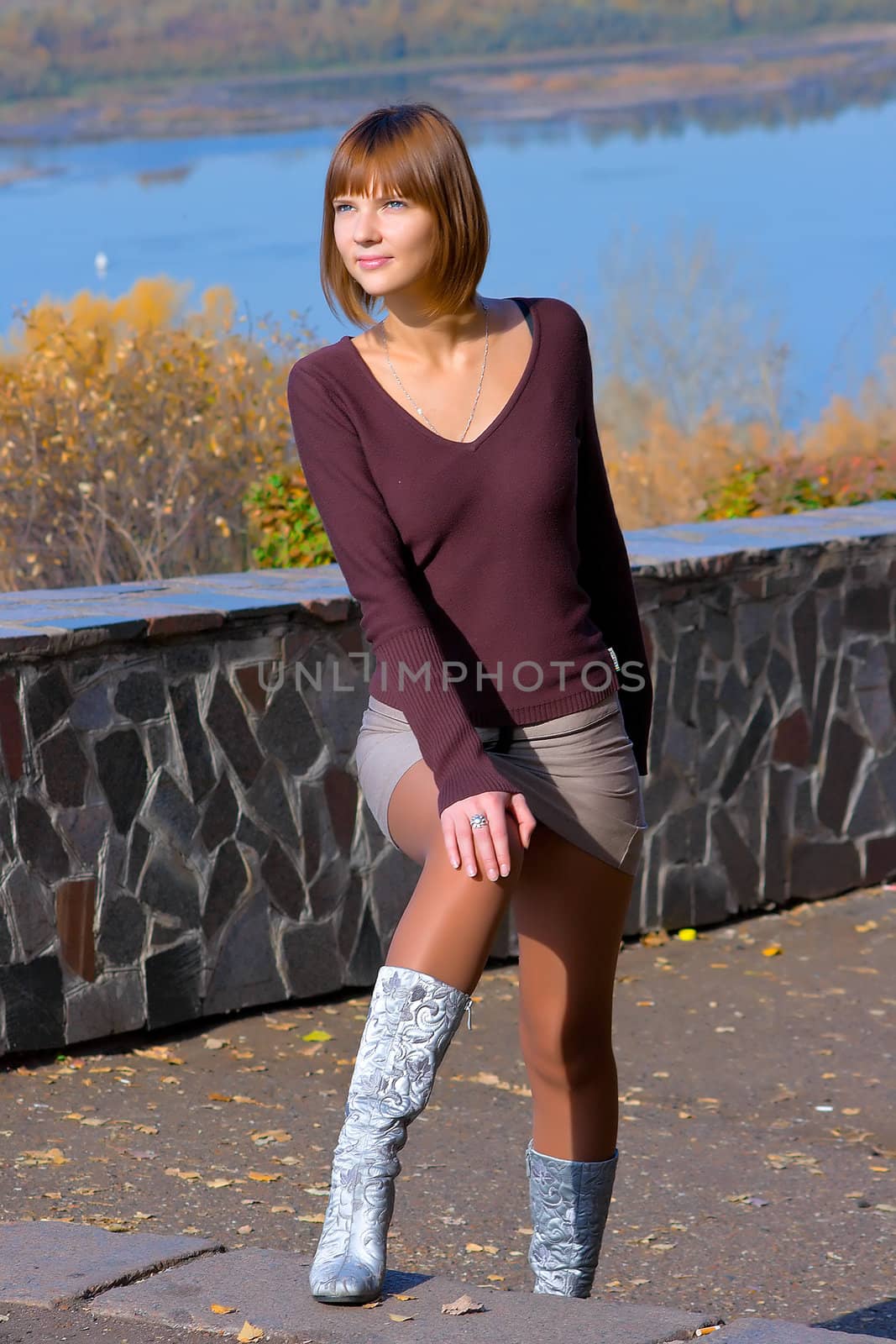 The young girl against autumn nature