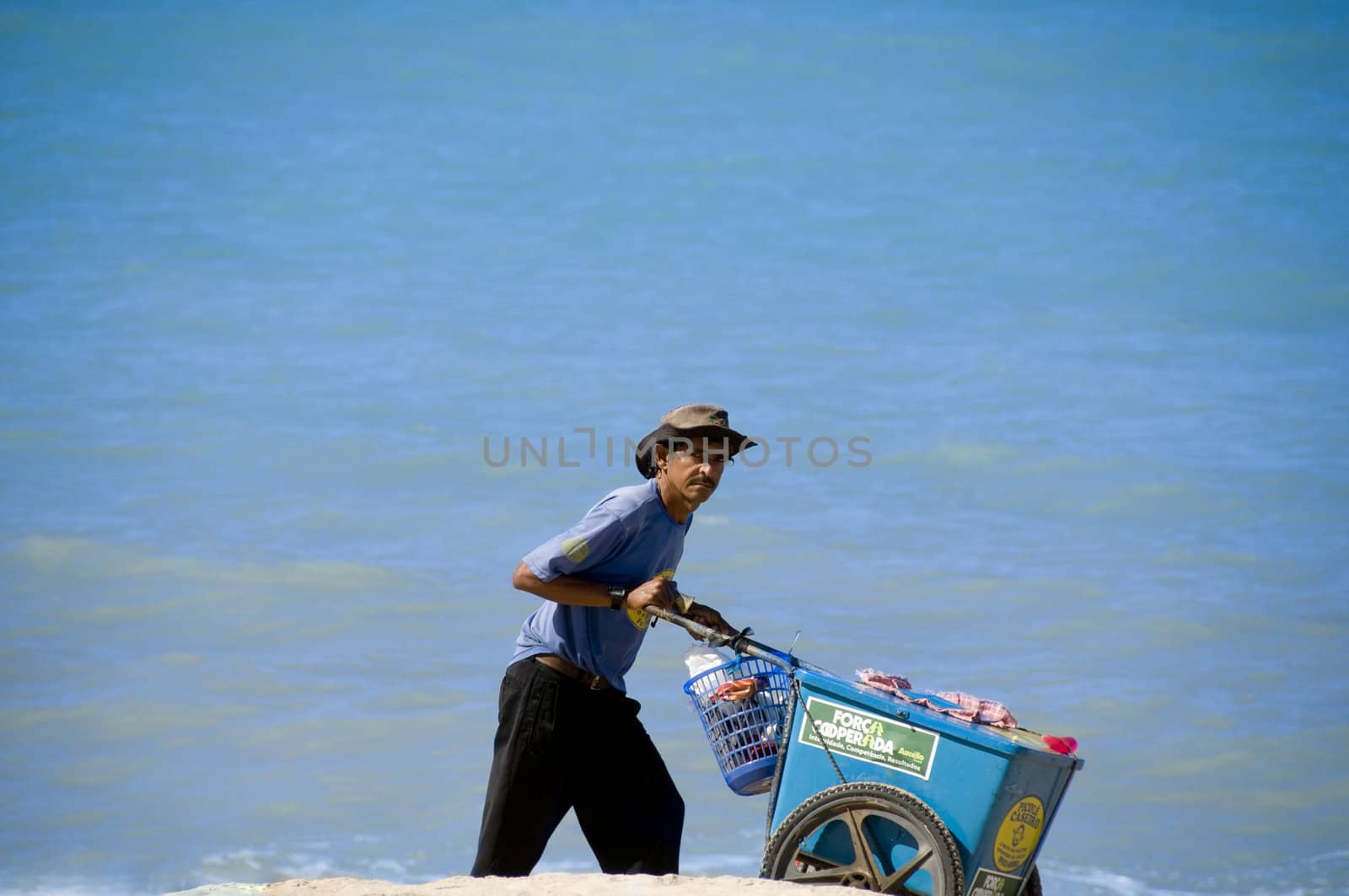 Man walking with ice and drinks on the beach