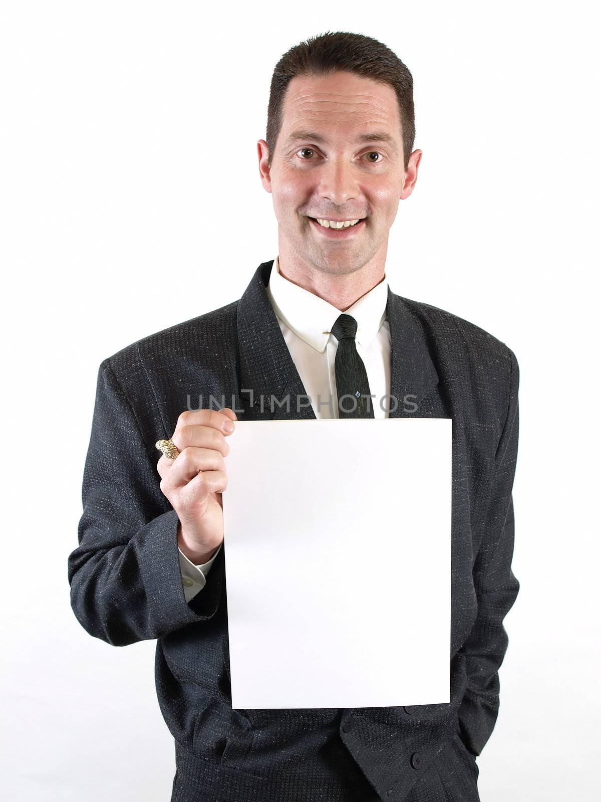 A man with a broad smile holds a blank white sign.