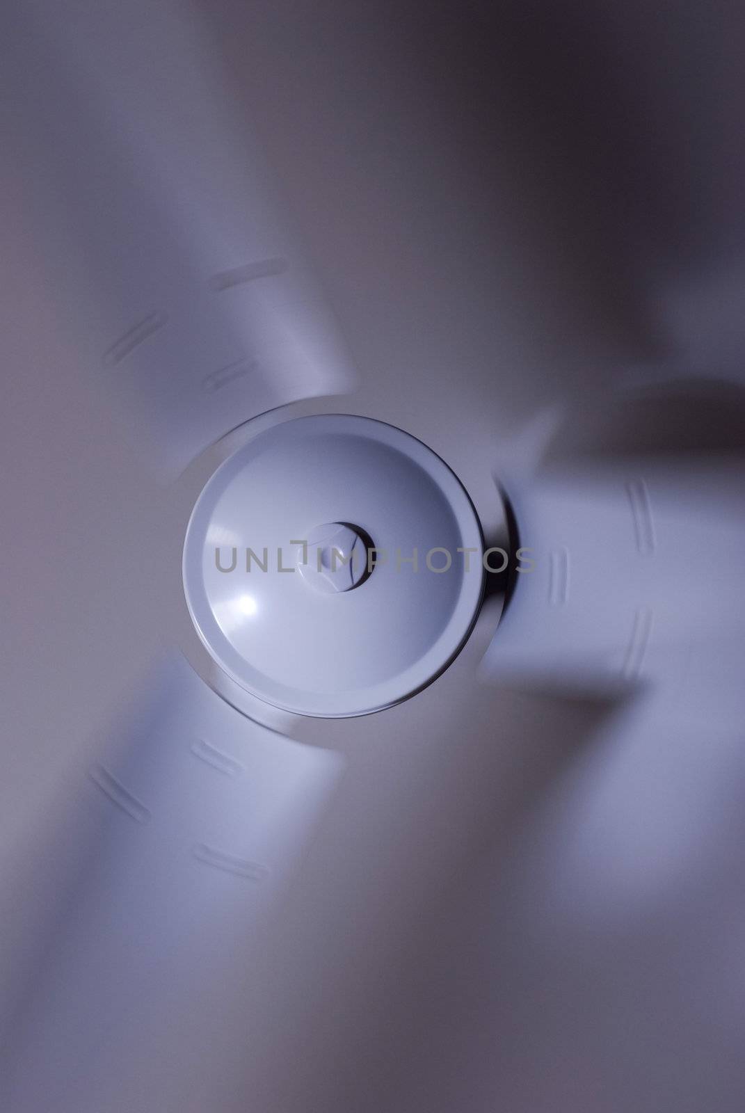 a modern ceiling fan with a motion blur
