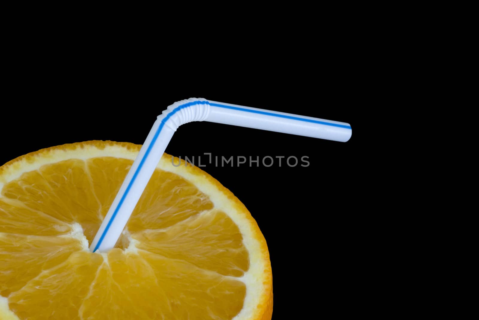 a ripe orange and a drinking straw