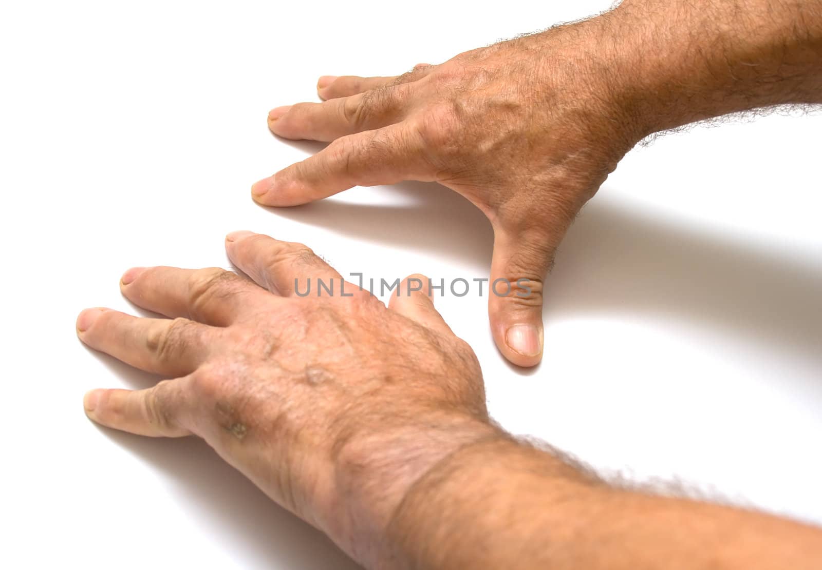 Two male hands on a white background. Isolation