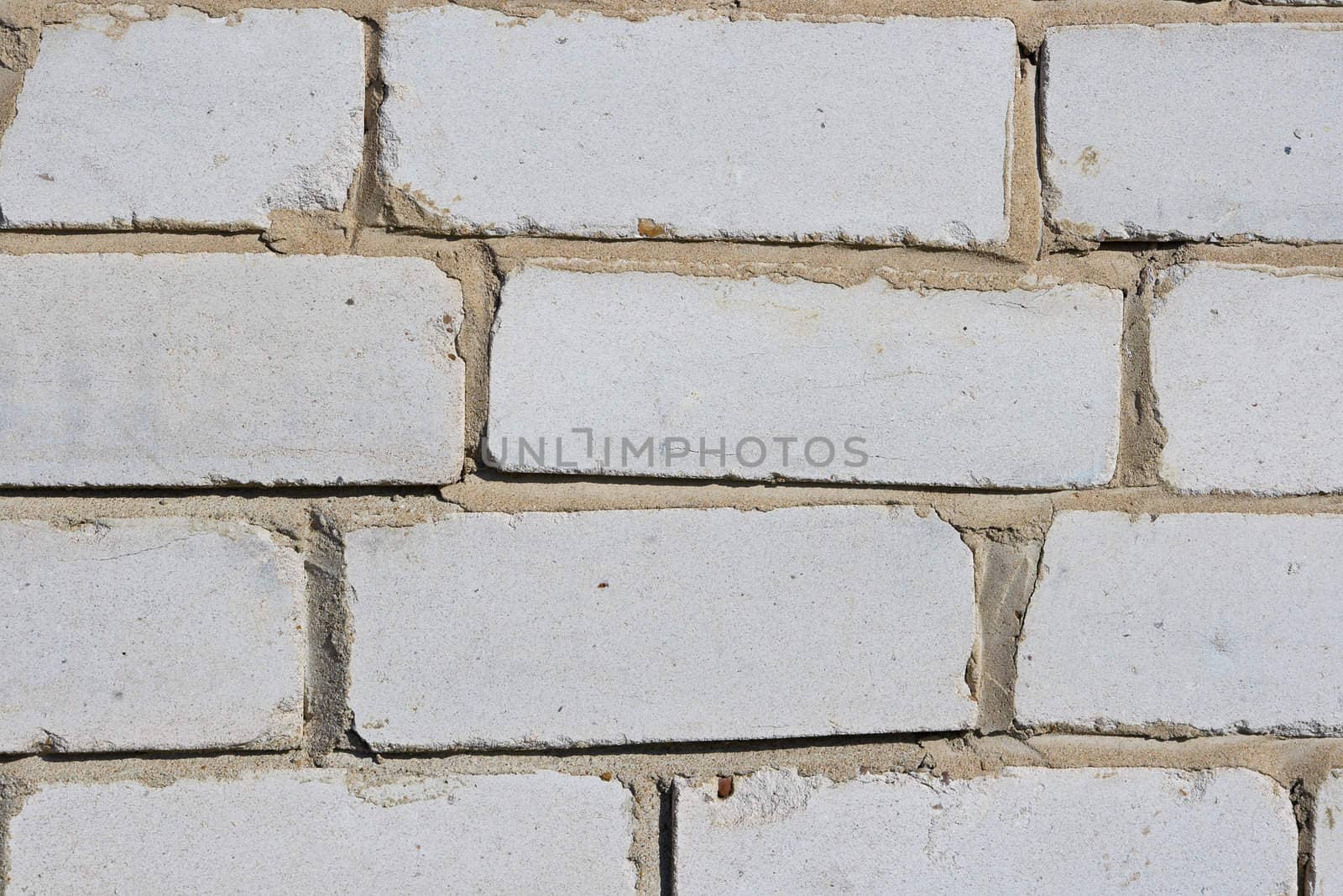 Texture of a wall of the house from a white brick. A background