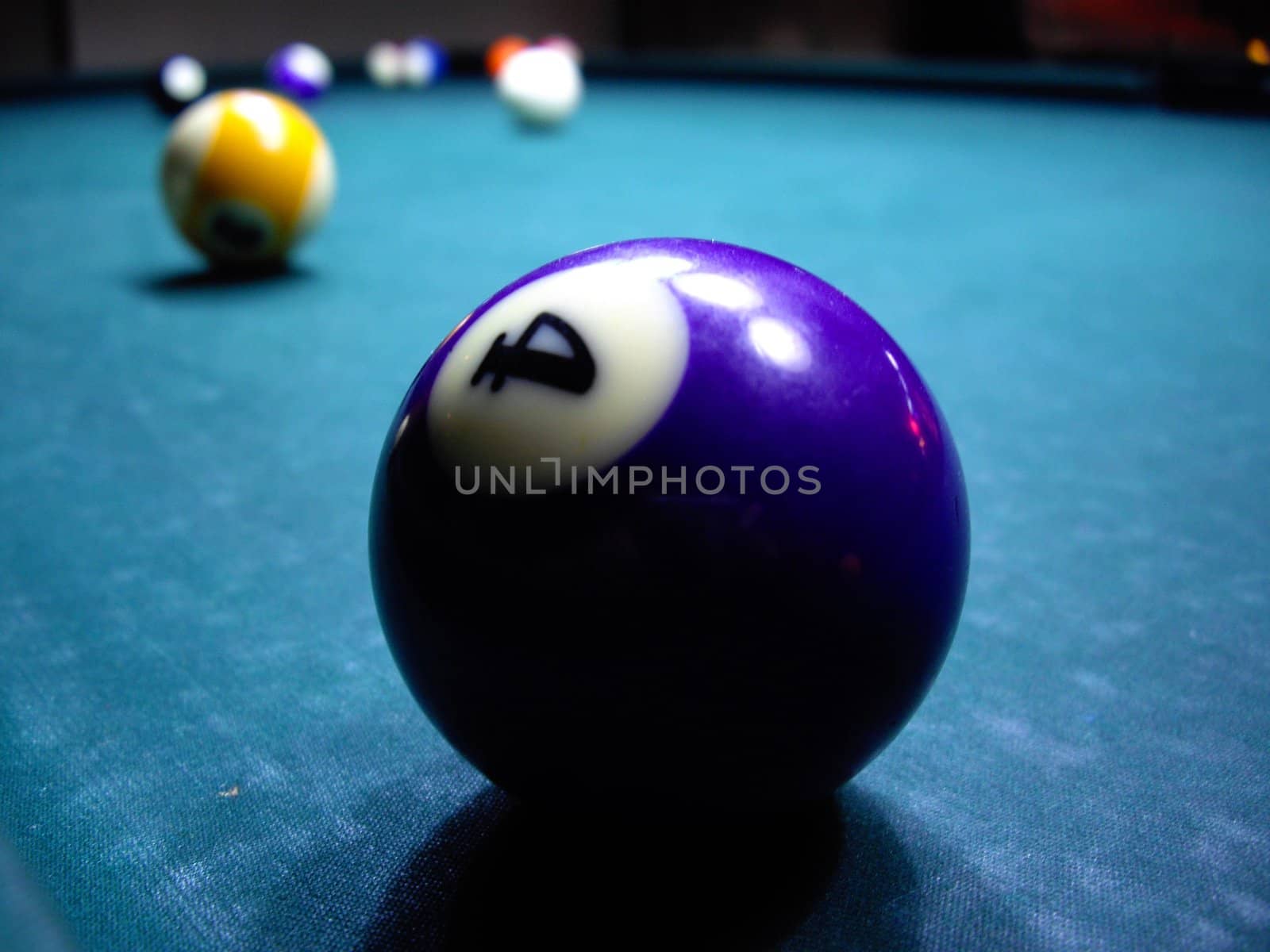 billiard balls on the green table
