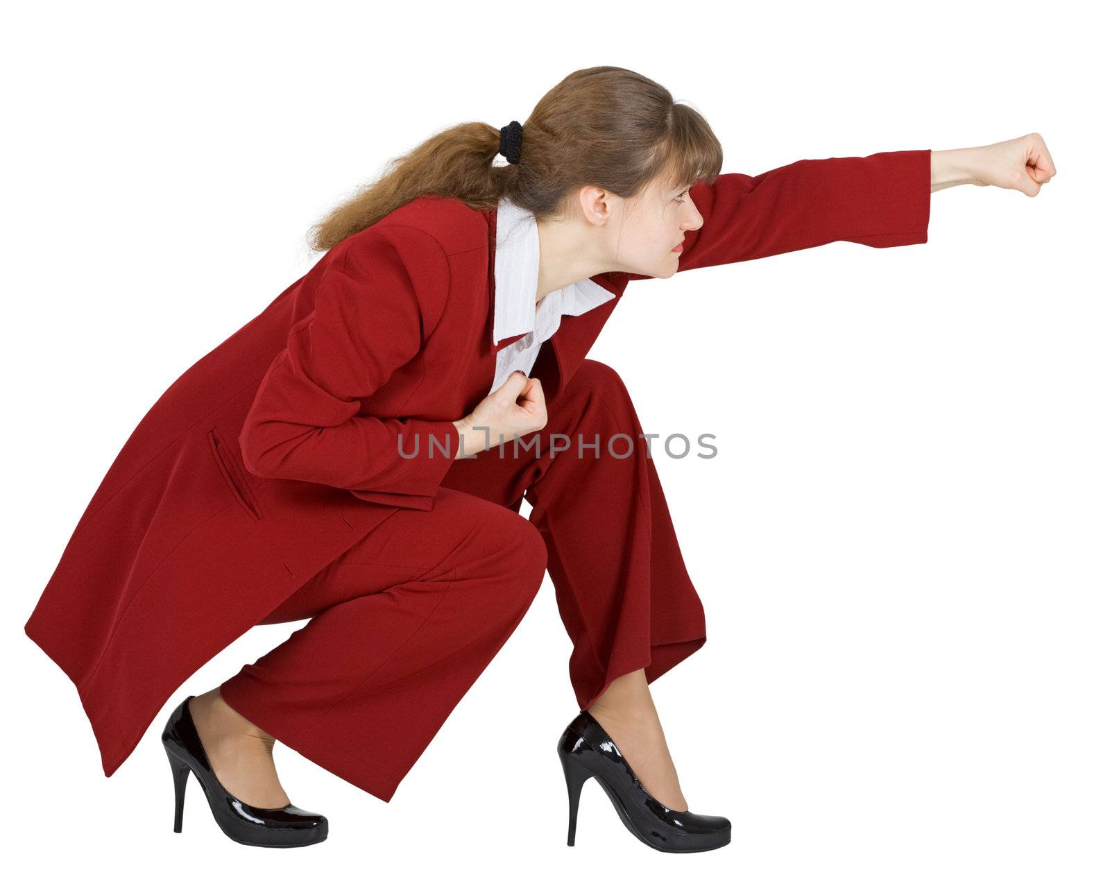 Businesswoman sits in a combat position on a white background