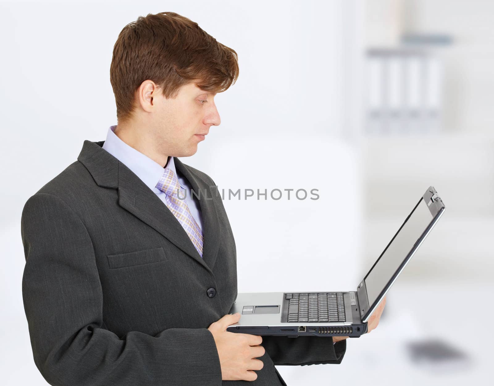 The engineer works with a laptop on the hands