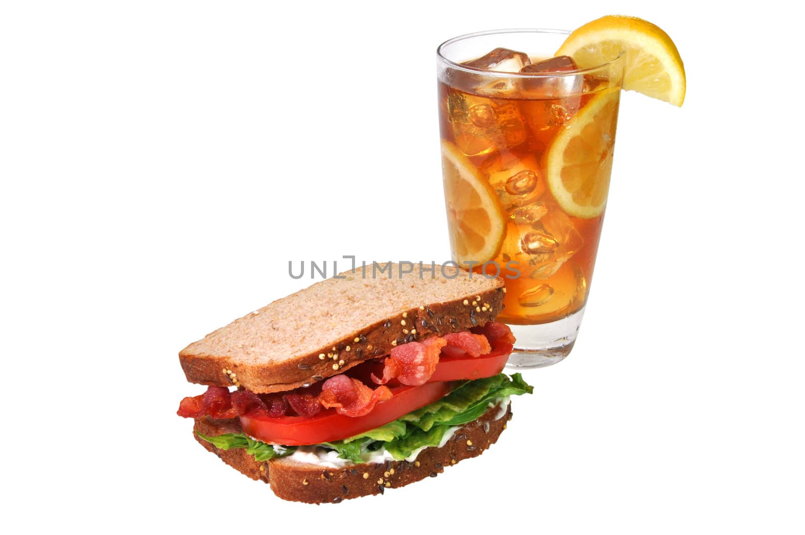 Bacon, lettuce, and tomato sandwich with iced tea with lemons.  Isolated on white background with clipping path.