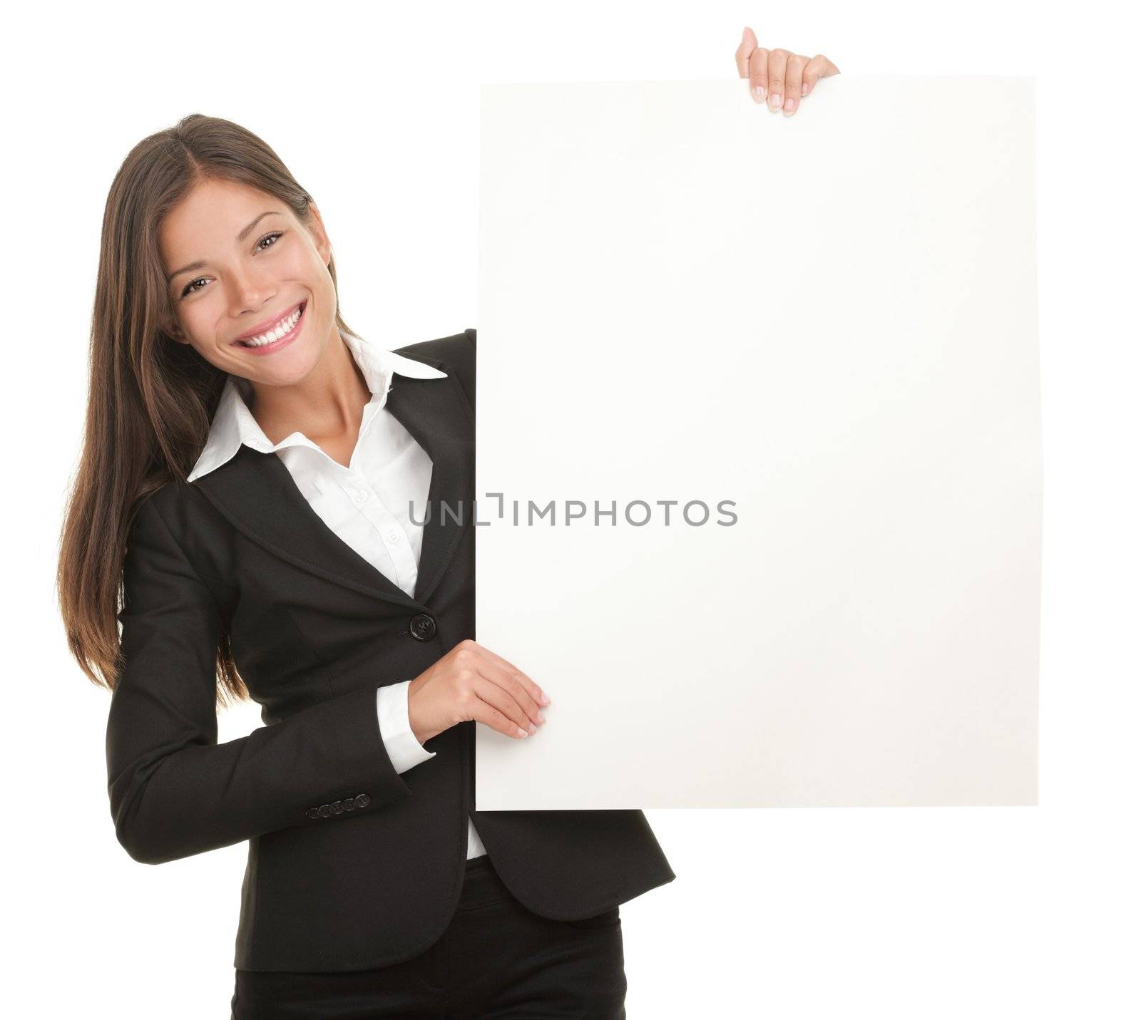 Businesswoman holding blank whiteboard sign. Casual business woman in suit is holding blank billboard placard and showing its empty copy-space. Isolated on white background.