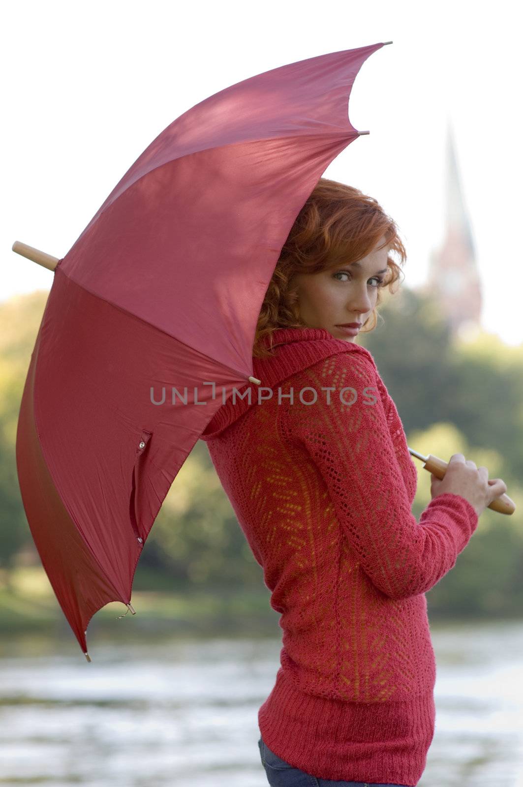 nice portrait of cute woman with hair pullover and umbrella in red color