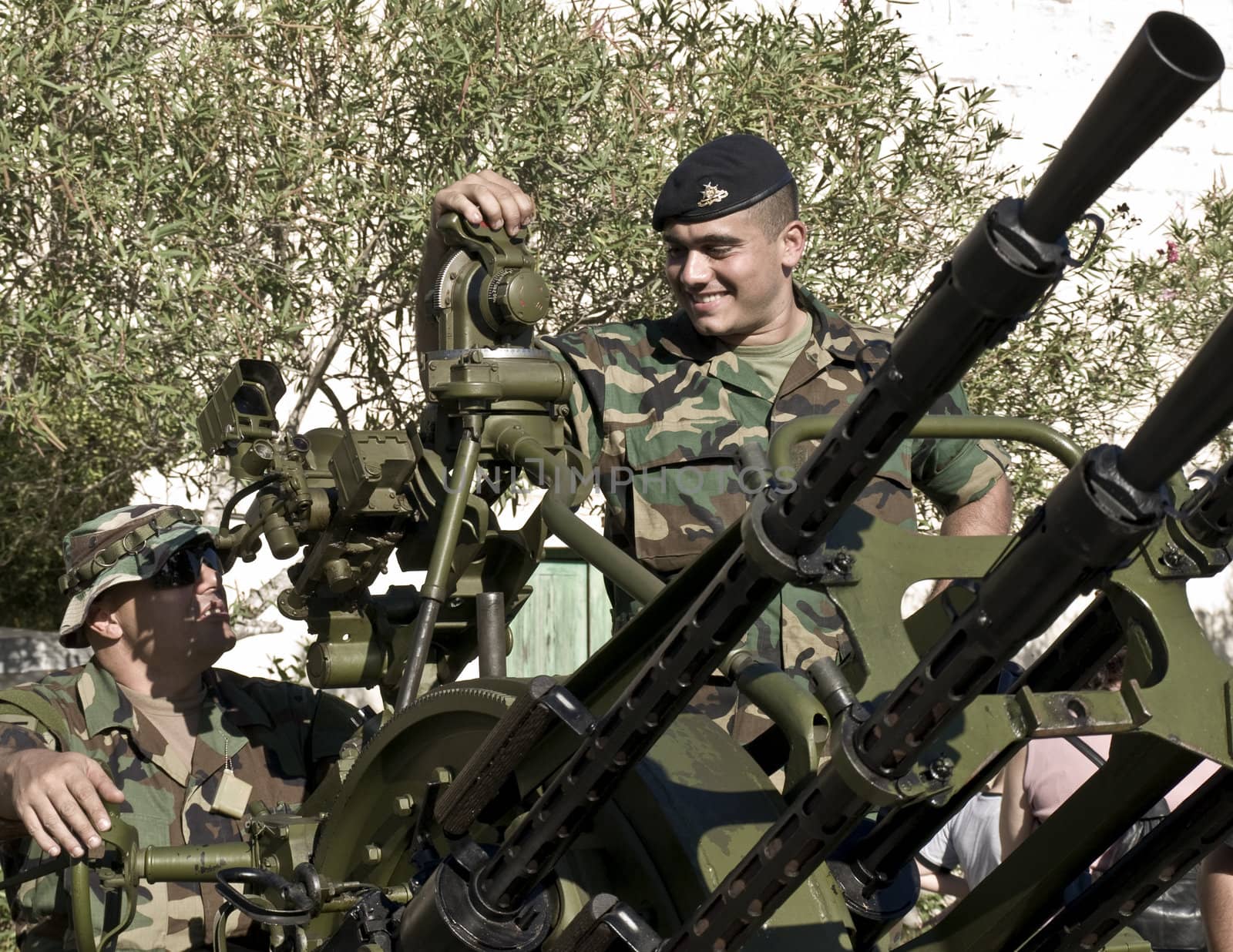 MALTA- OCTOBER 06 - Soldiers demonstrating an Anti-Aircraft Gun during an Armed Forces of Malta open day at Luqa Barracks