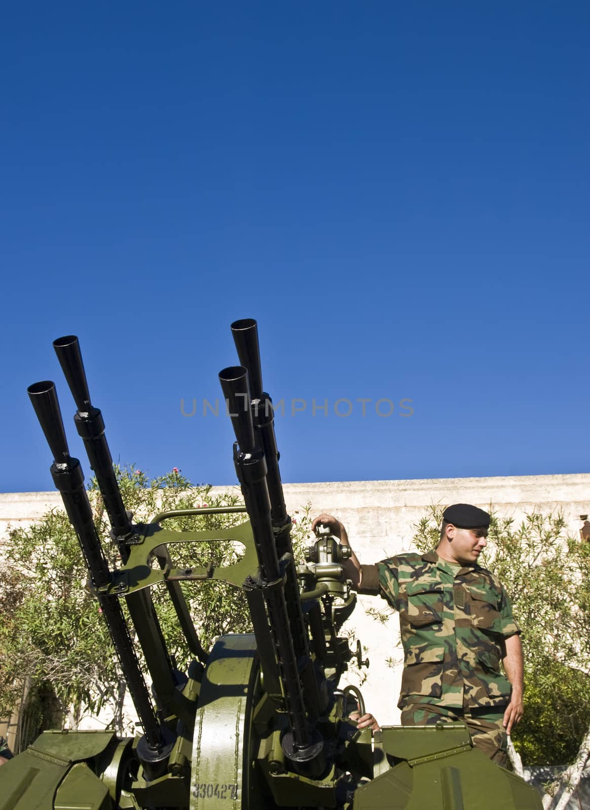MALTA- OCTOBER 06 - Soldiers demonstrating an Anti-Aircraft Gun during an Armed Forces of Malta open day at Luqa Barracks
