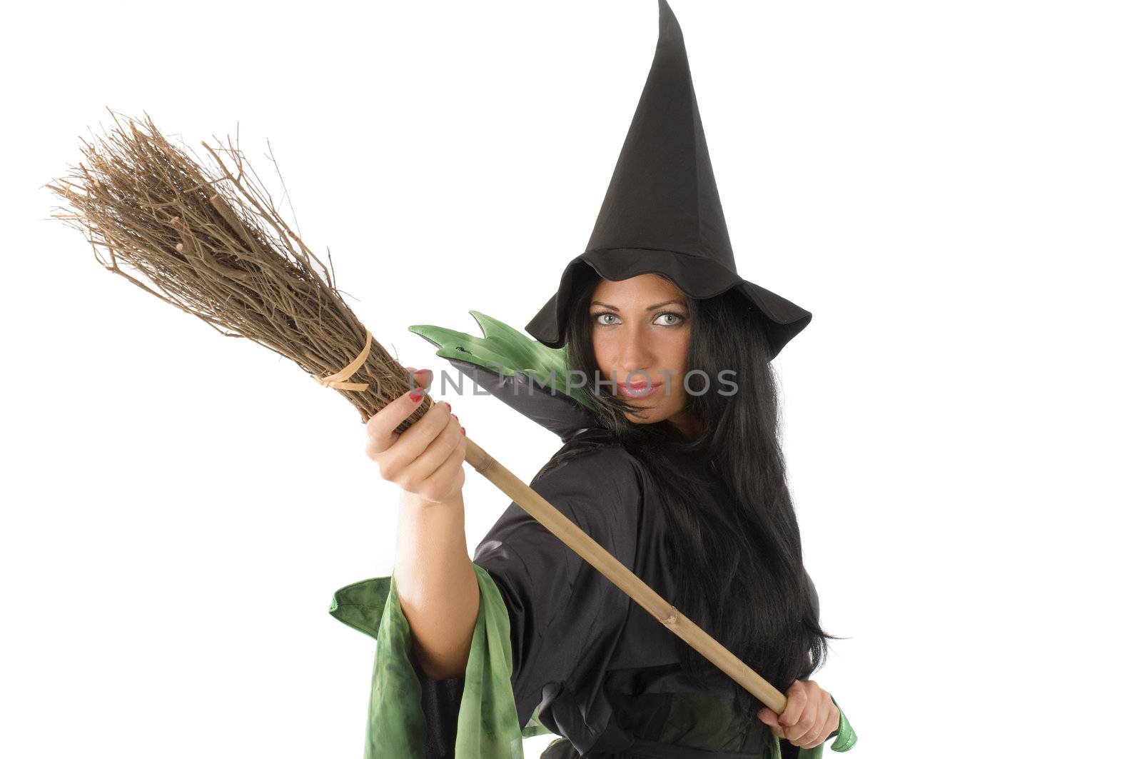 close up of a cute witch with hat playing with a broom