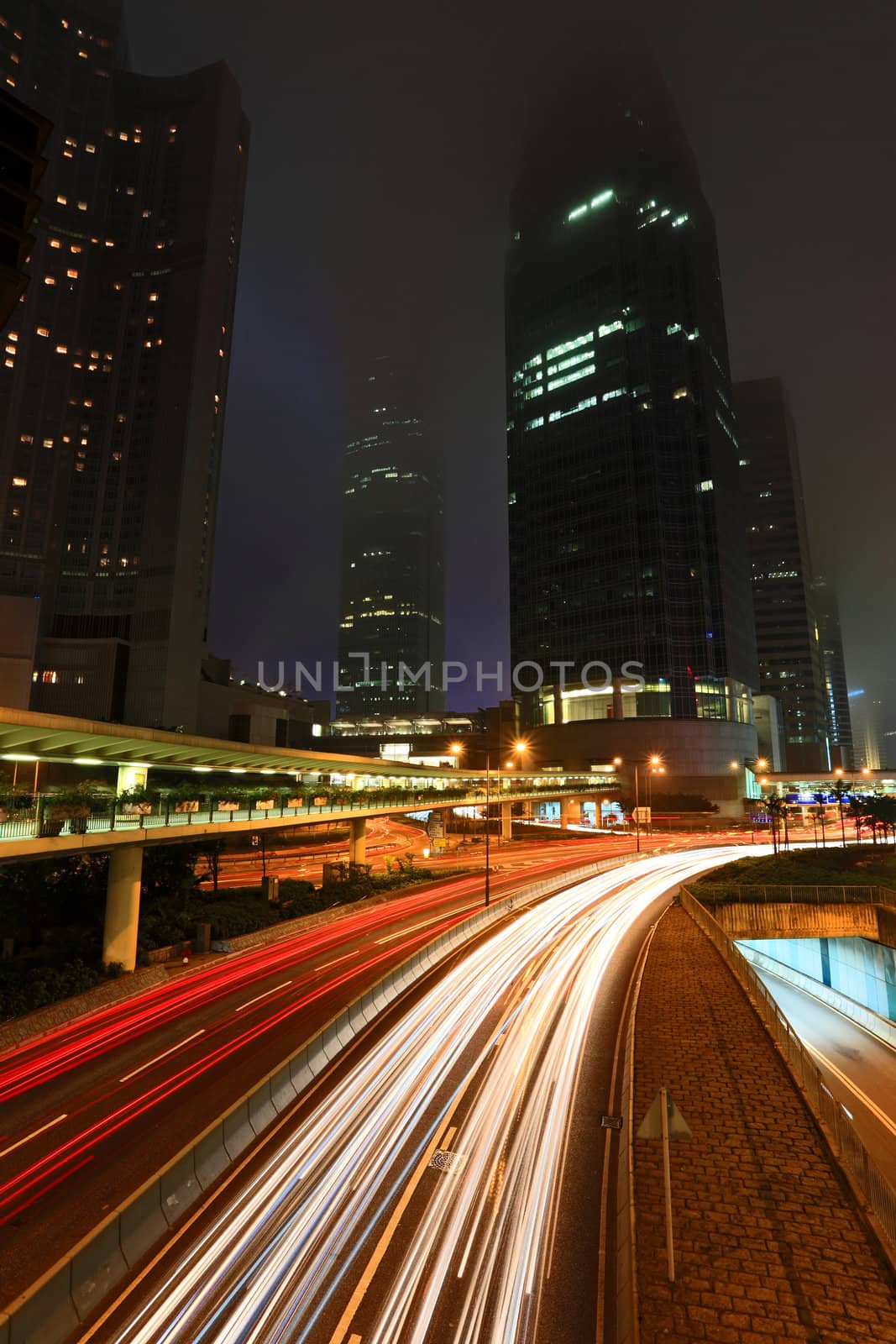 Blurs of night city traffic streams