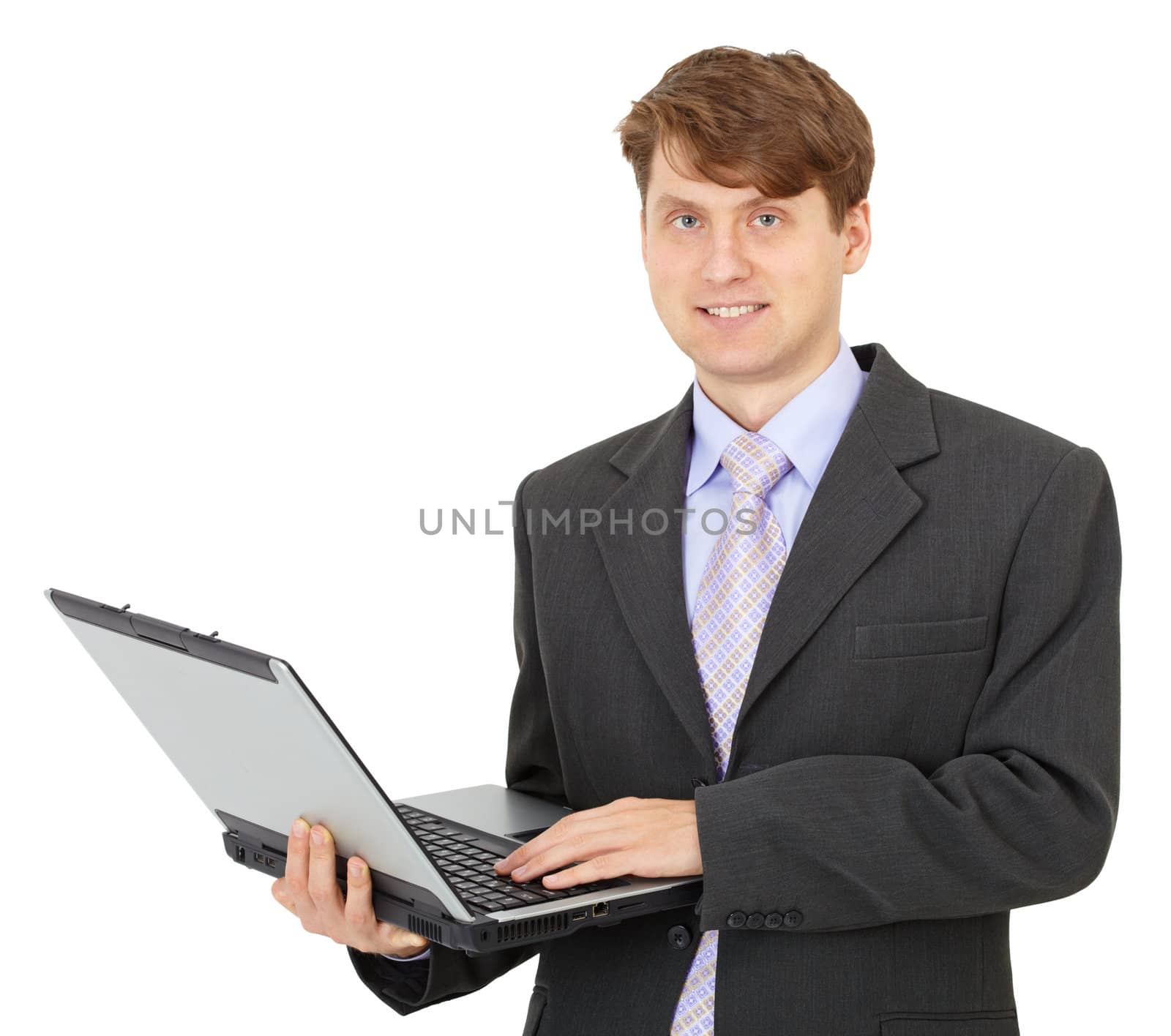A young businessman with a computer in hands on a white background