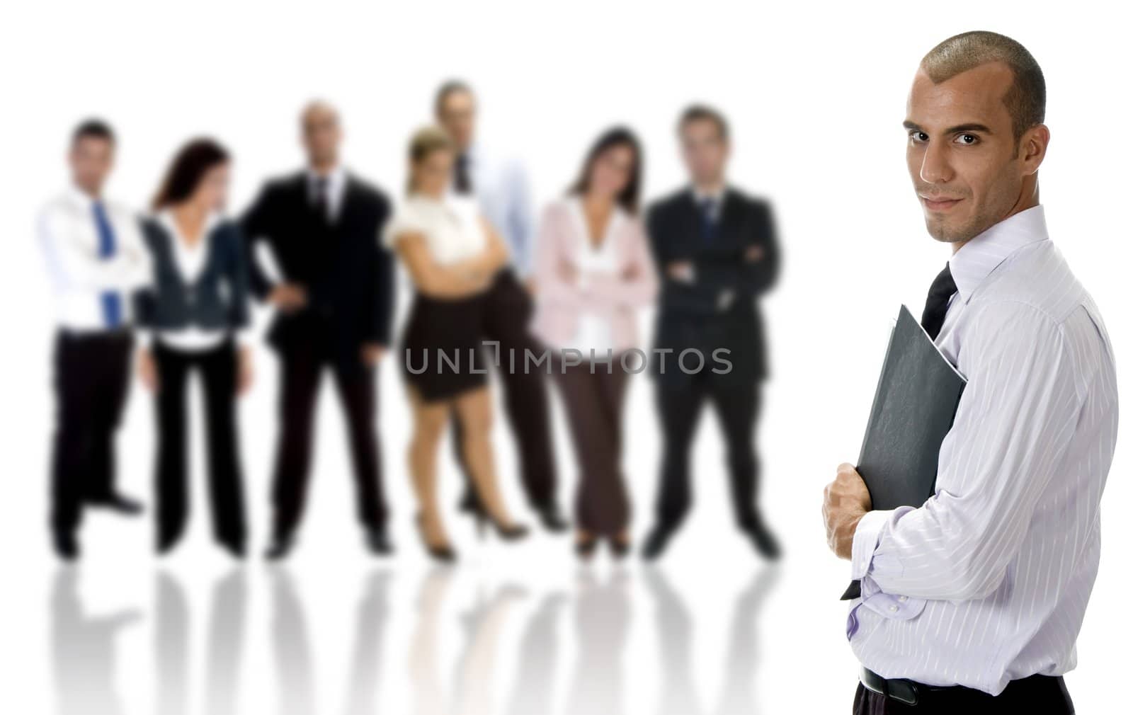 side view of young businessman with folder and group