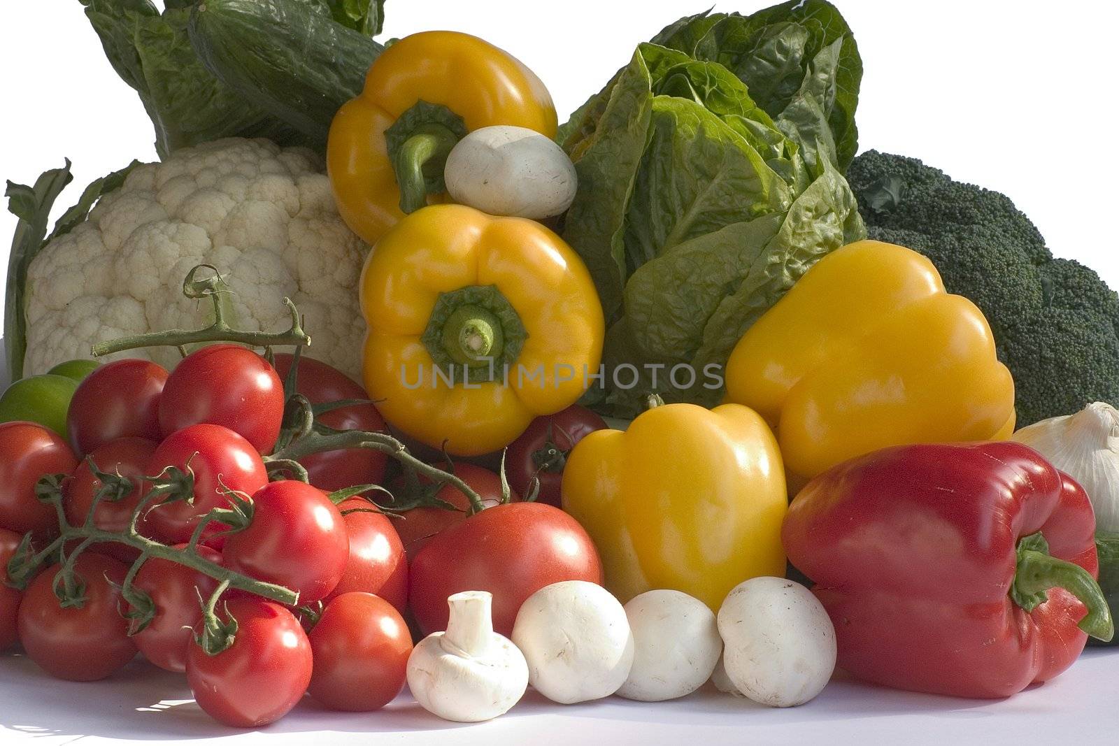 fresh cucumbers and tomatoes and peppers isolated on a white background