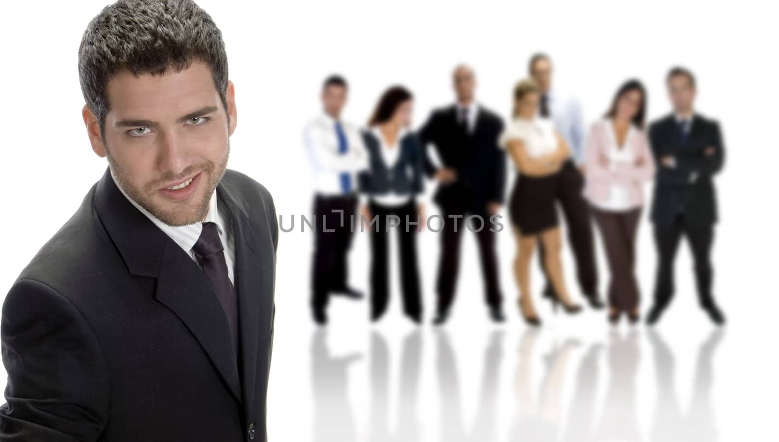 smiling young businessman with business group