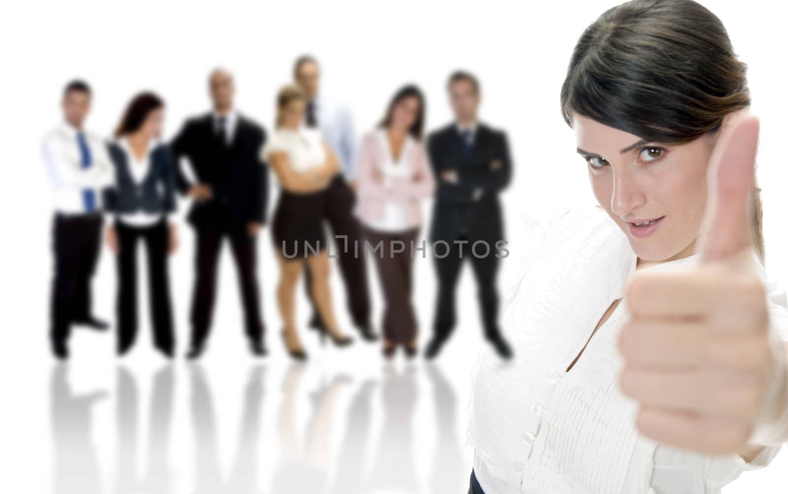 smiling lady showing approval sign with business group