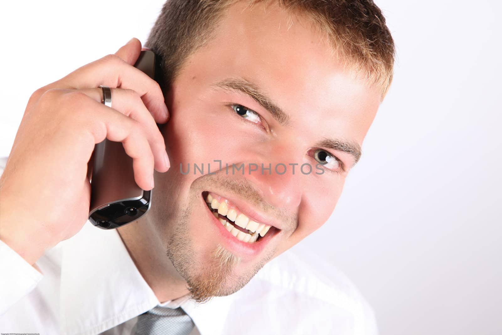 Corporate Man Smiling On The Phone by nfx702