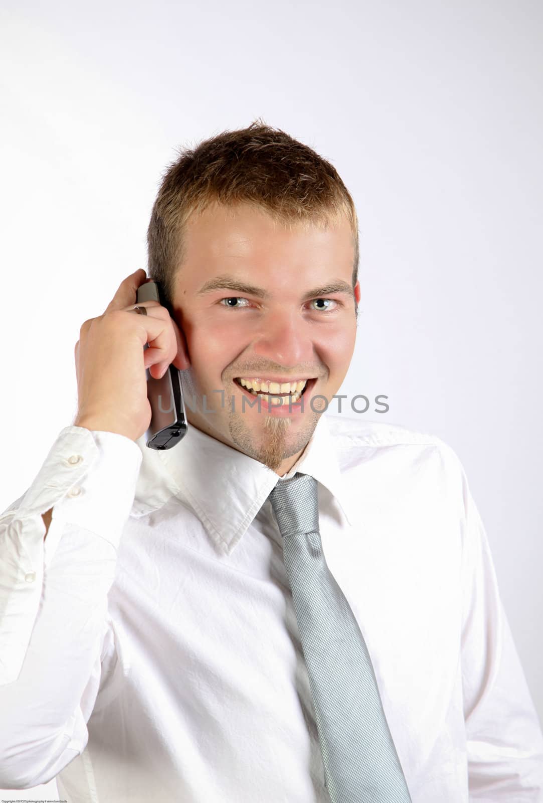 Cheerful Young Man On The Phone by nfx702