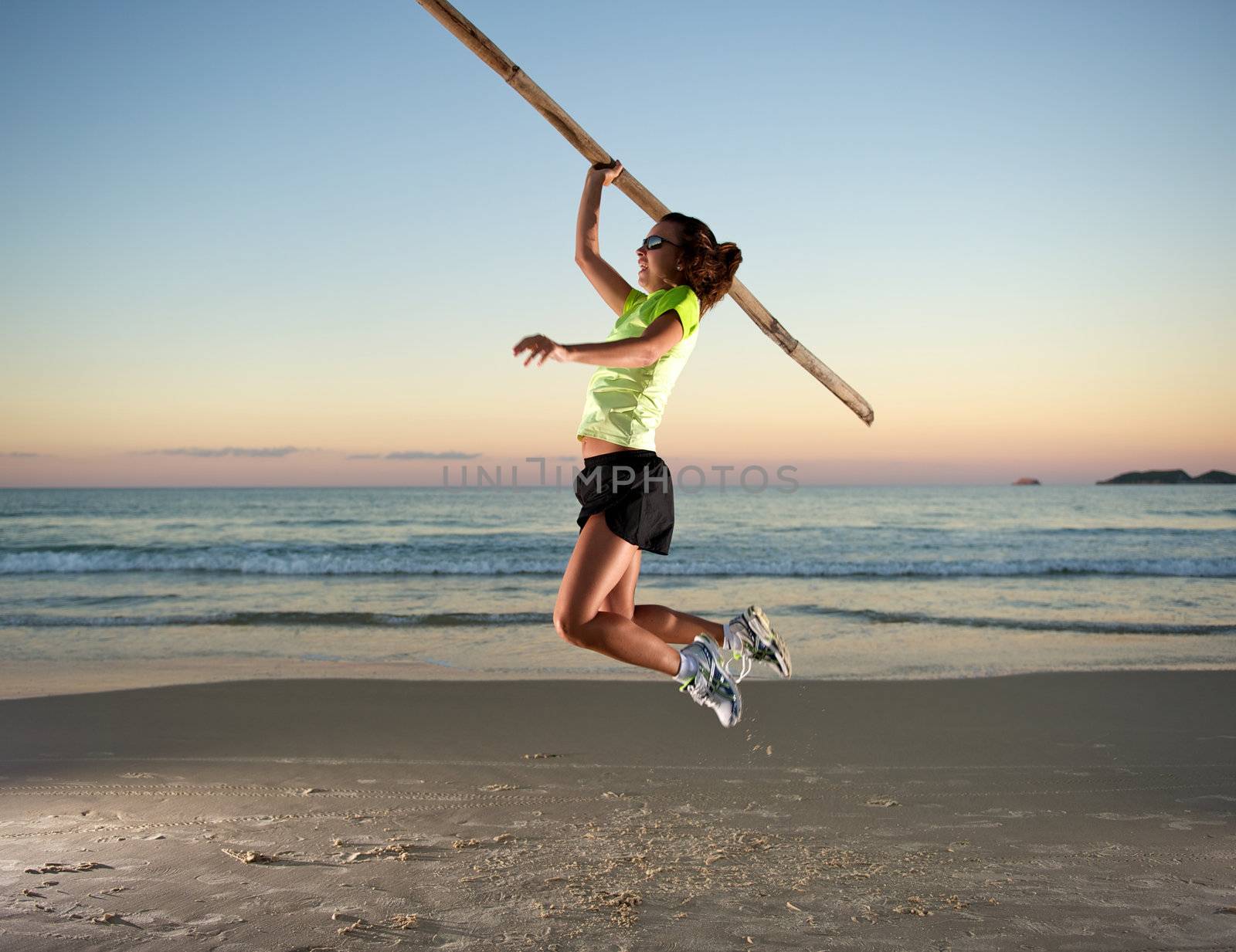 Woman doing exercises during sunset with sunglasses in Florianopolis, Santa Catarina, Brazil, Nikon D3S, Nikon 24-70mm, RAW shooting.