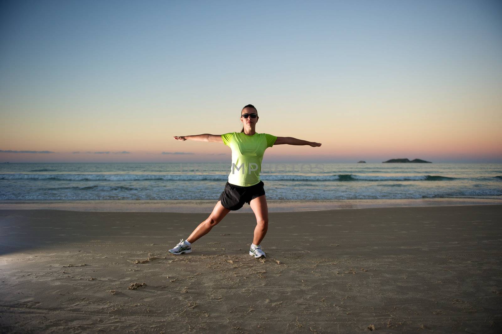 Woman doing exercises during sunset with sunglasses in Florianopolis, Santa Catarina, Brazil, Nikon D3S, Nikon 24-70mm, RAW shooting.