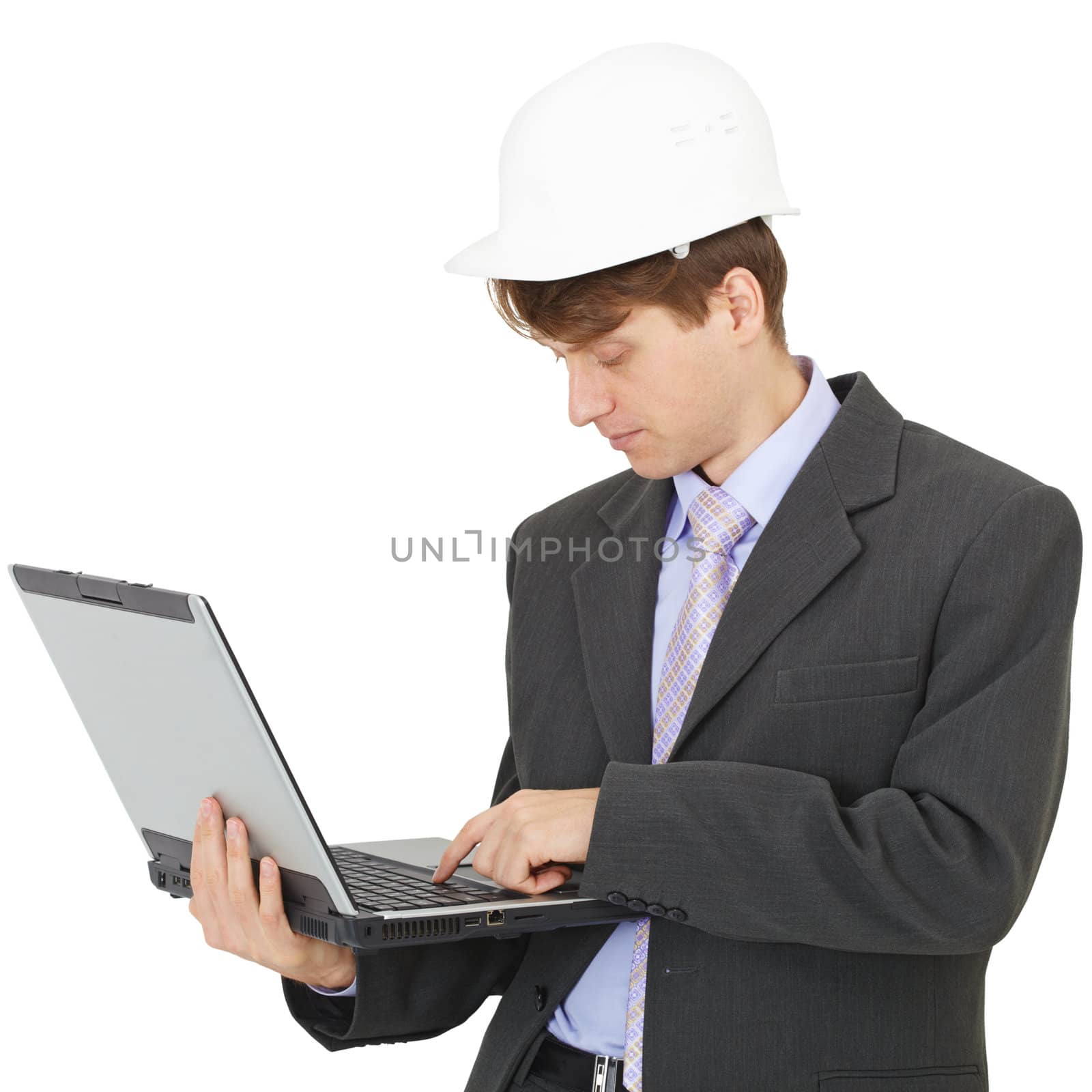 The builder works with the laptop holding it on hands on white background