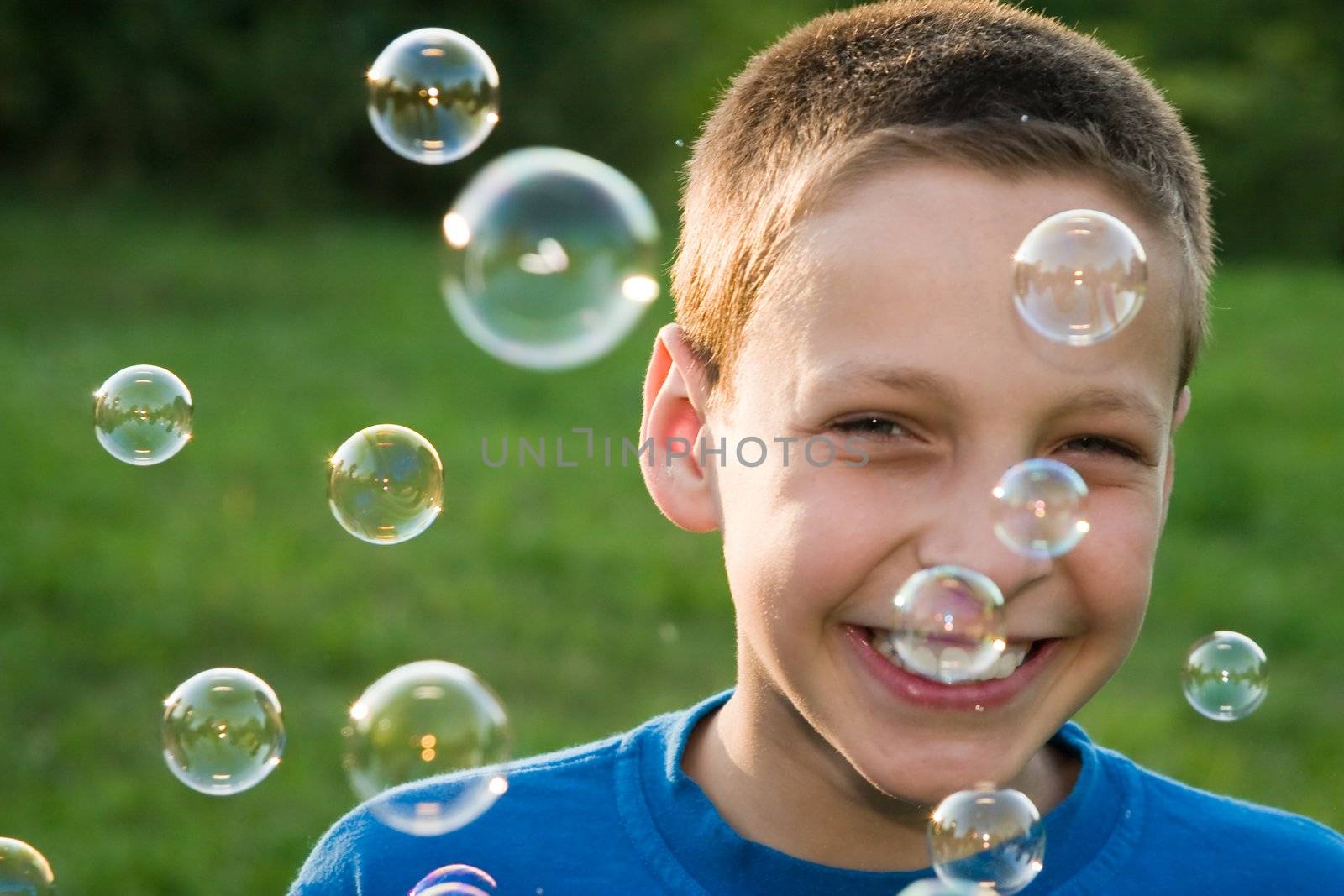children series: boy play with soap bubbles, smile