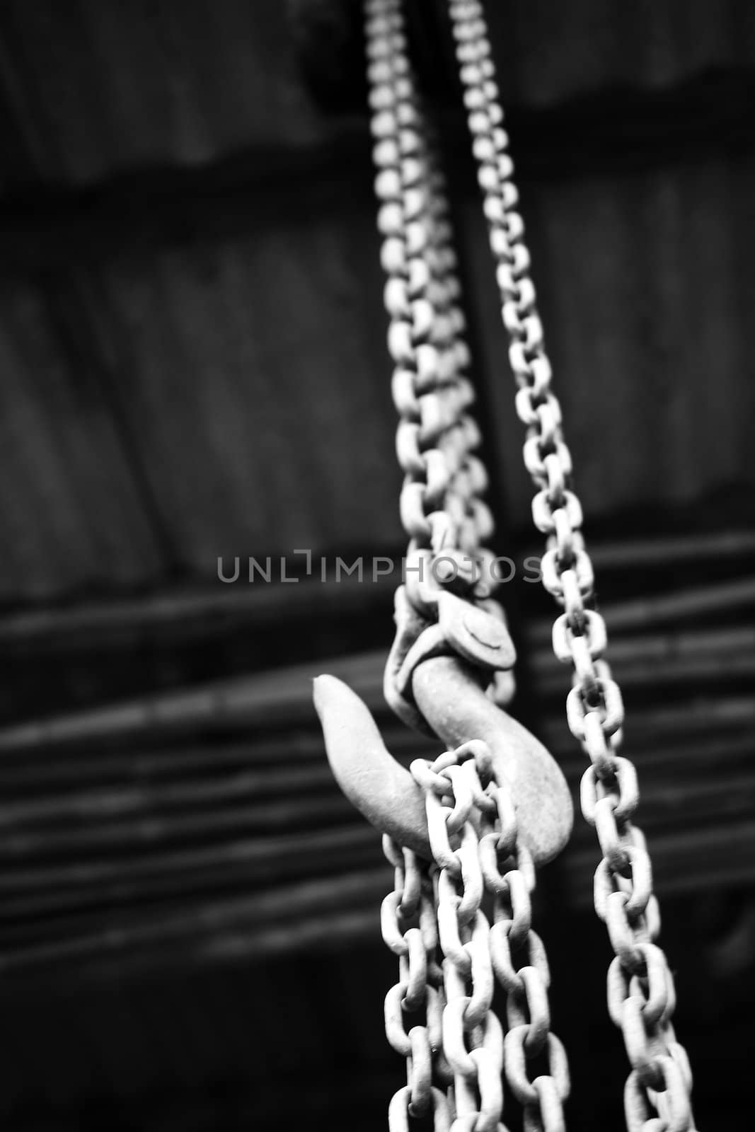 chain suspended in air over lighter background