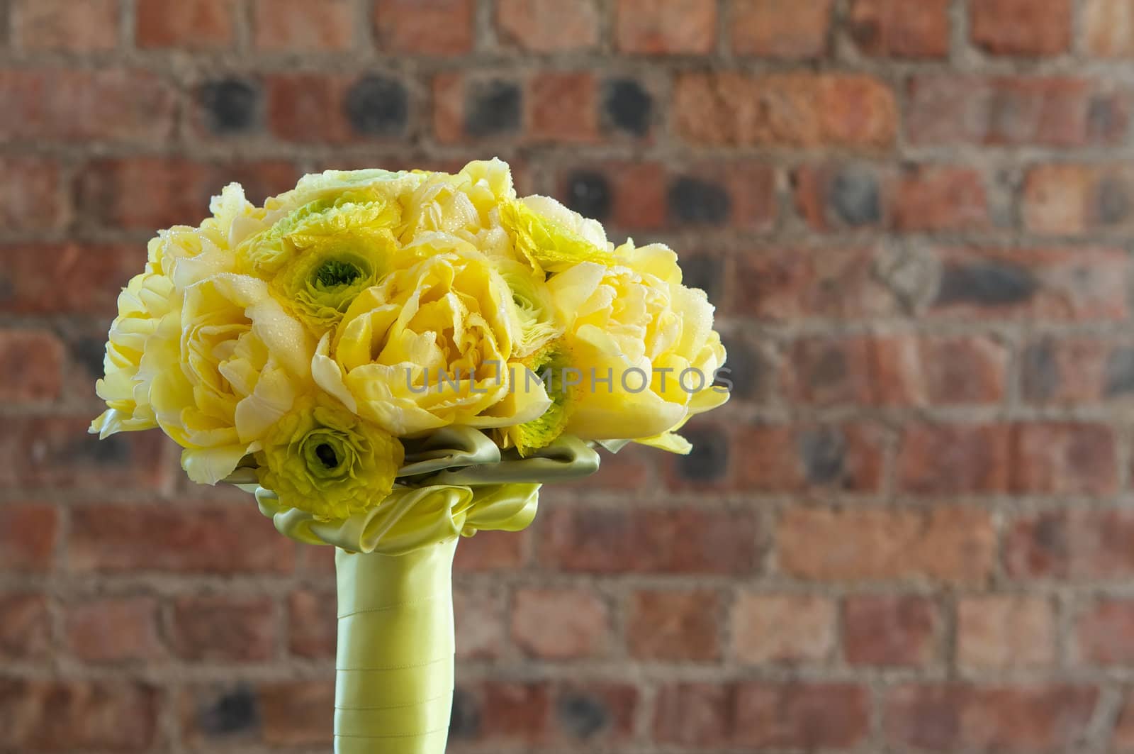 A colorful yellow bridal bouquet of flowers