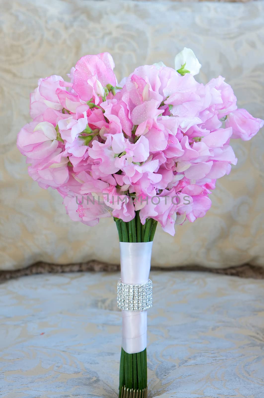 A colorful pink bridal bouquet of flowers