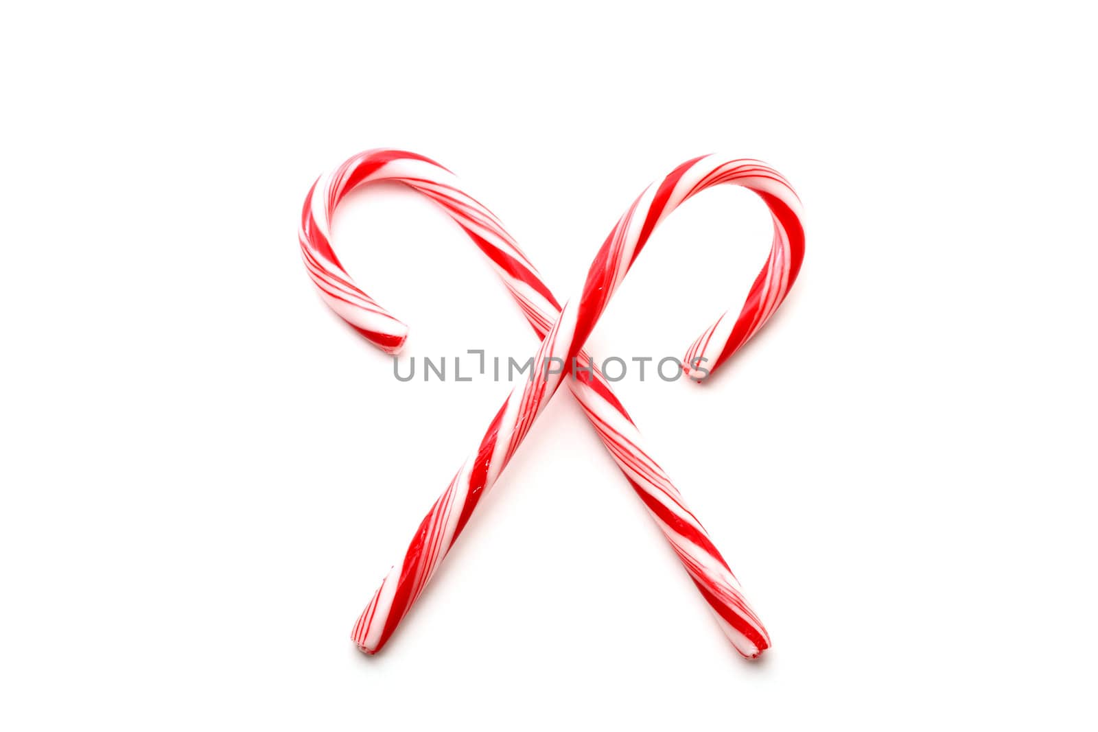 Two red and white Christmas candy canes by svanblar