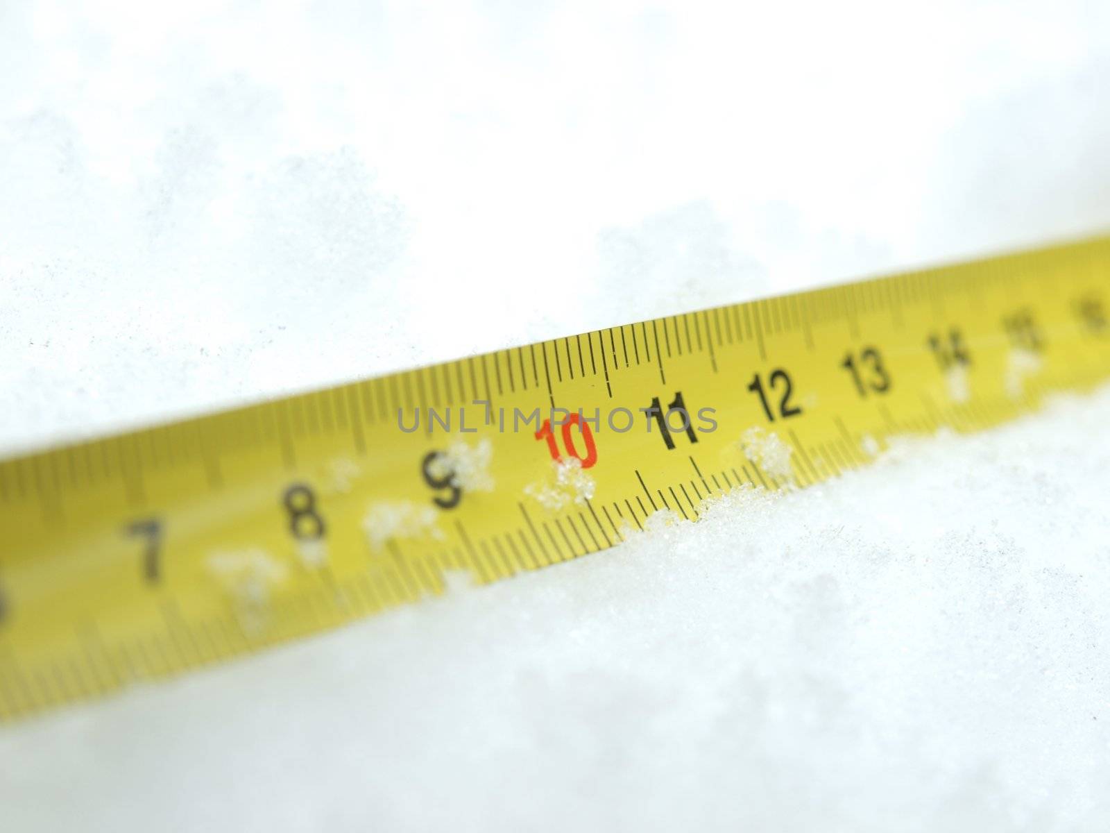 Measuring tape on a snow in the winter         