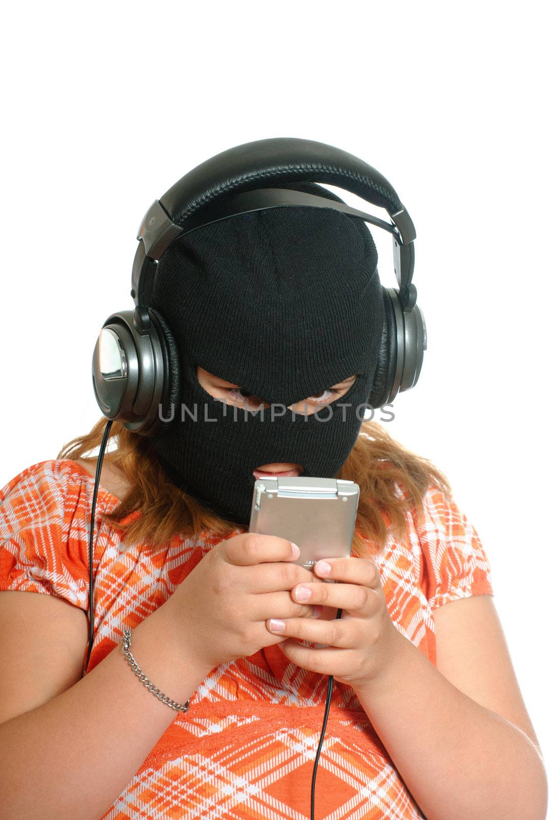 Concept image of a young girl listening to pirated or illegal music downloads on her mp3 player, isolated against a white background.