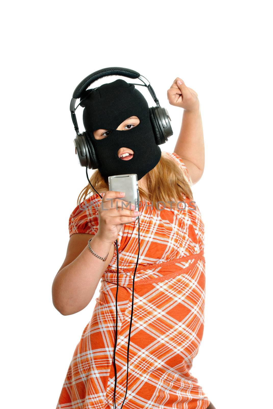 Concept image of a young girl dancing to pirated or illegal music downloads on her mp3 player, isolated against a white background.