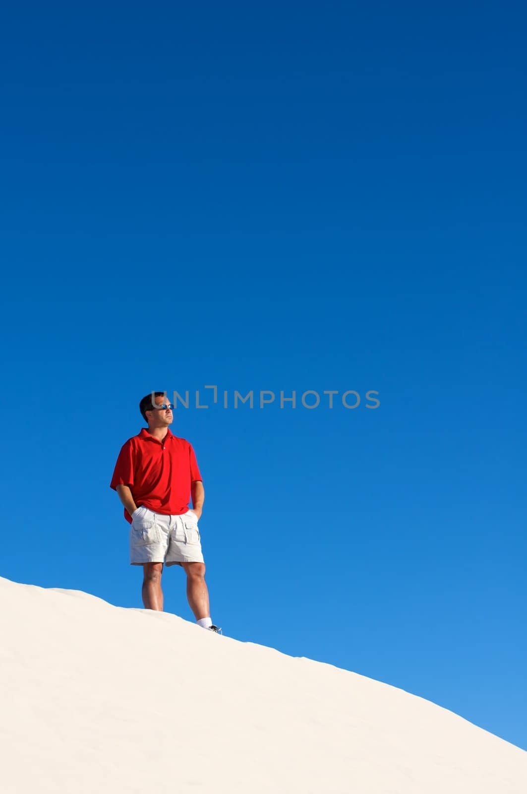 An image of a man looking out into the desert