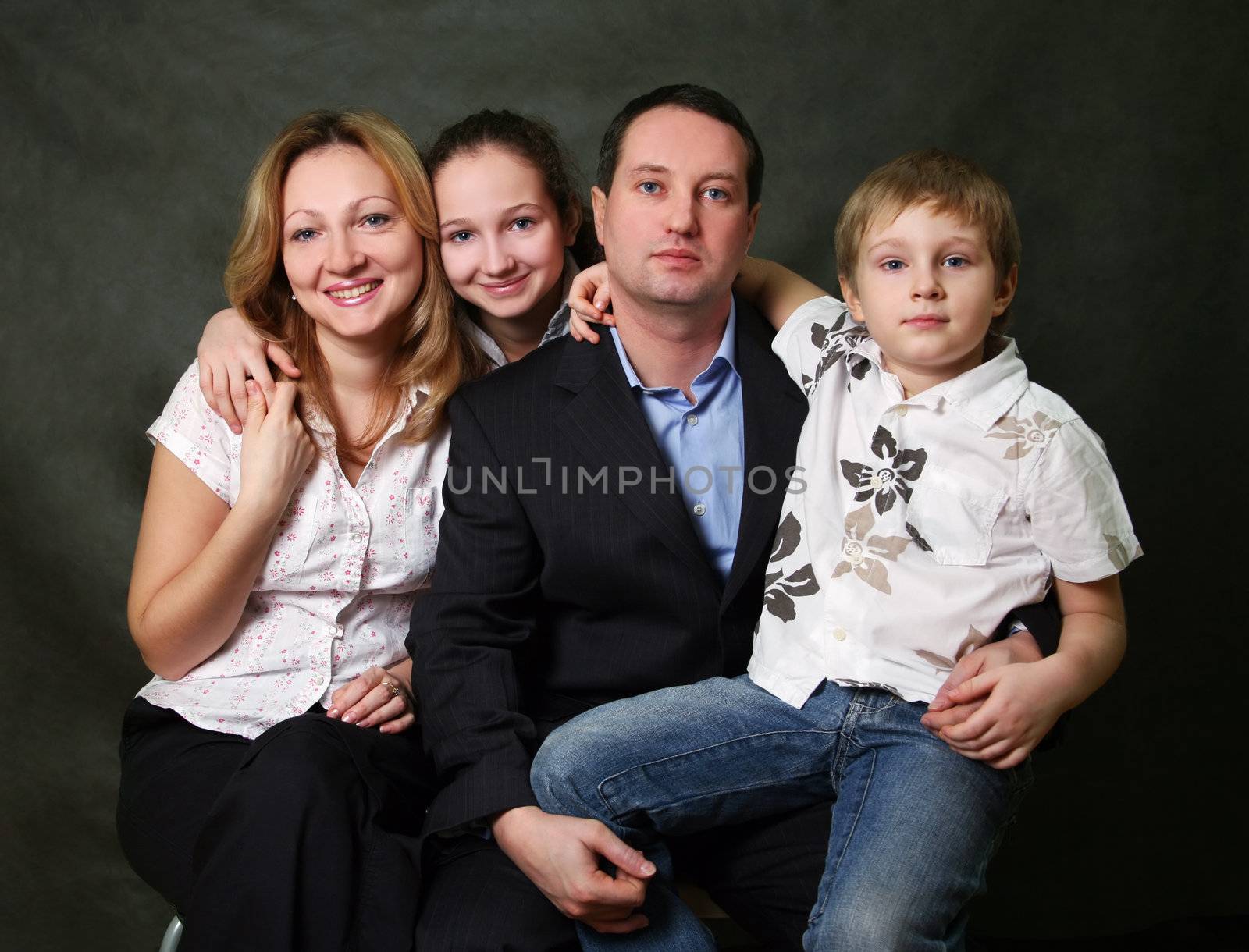 Portrait of parents and children in studio