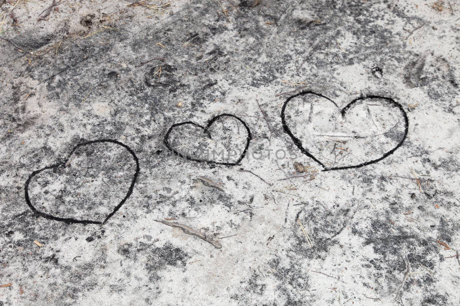 Three Hearts - painted in the sand  by Farina6000
