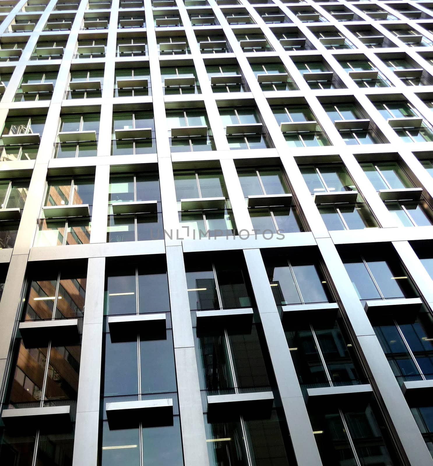 An abstract view of some windows on a modern office building.