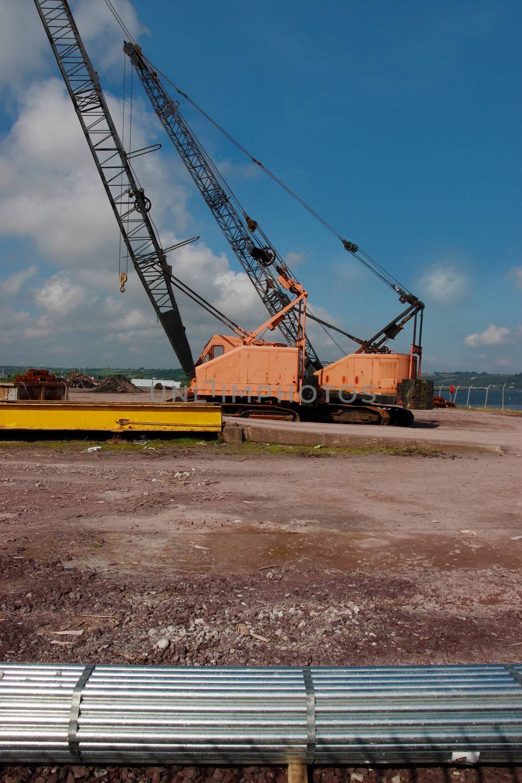 a pair of cranes on an irish quay