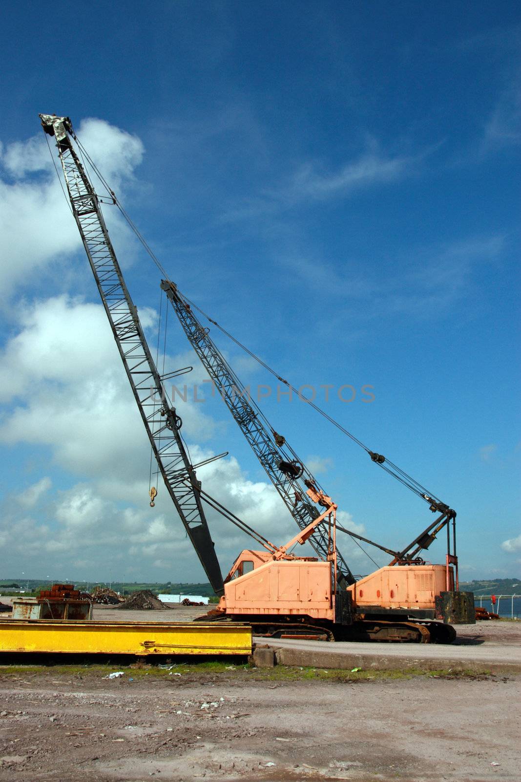 a pair of cranes on an irish quay